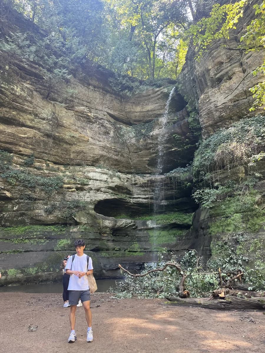 Hongda in front of a canyon waterfall at Starved Rock